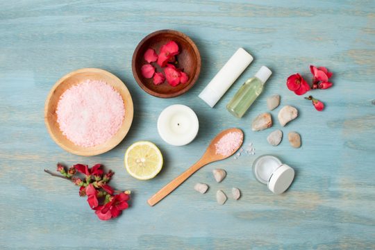 Flat lay spa arrangement on rustic background