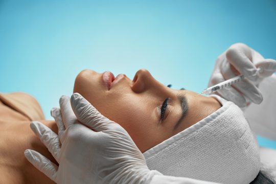 Cosmetic botox injection in female forehead