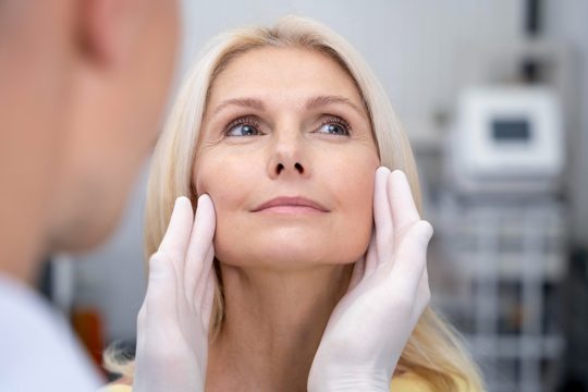 Close up doctor checking smiley woman