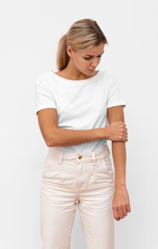 Front view of woman having elbow pain