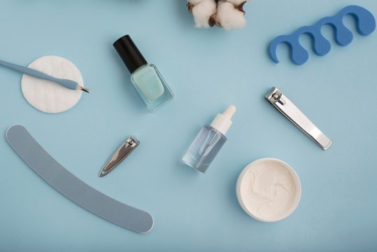 Flat lay nail care items arrangement