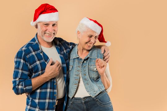 Cool senior couple with christmas hat