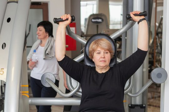 Senior woman at gym working out
