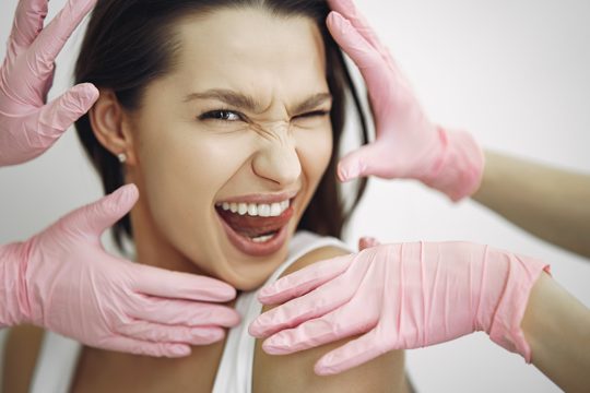 Woman standing in a cosmetology studio