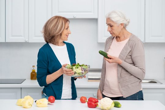 Mature women ready to cook together