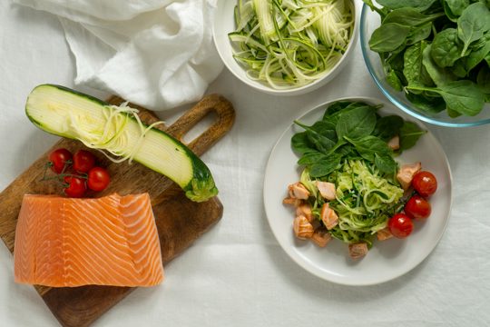 Flat lay salmon and vegetables arrangement